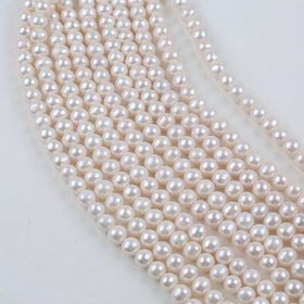 Wholesale Big Size 10-11mm Natural White Freshwater Near Round Pearl Strands