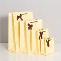 Wholesale LOGO Printing Luxury Bow Card Paper Shopping Clothing Bag Women's Packaging Gift Paper Bags
