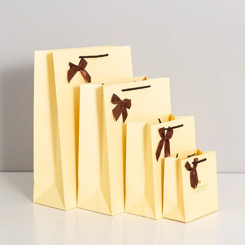 Wholesale LOGO Printing Luxury Bow Card Paper Shopping Clothing Bag Women's Packaging Gift Paper Bags