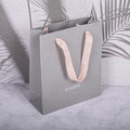 Custom Logo Art Paper Environmental Fashion Bag for Promotion Packing Grocery Use with Recyclable Feature and Creative Ribbon