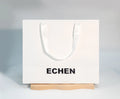 Custom Logo Printed White Gift Paper Bags with Ribbon Rope Kraft Handle Shopping Paper Bag
