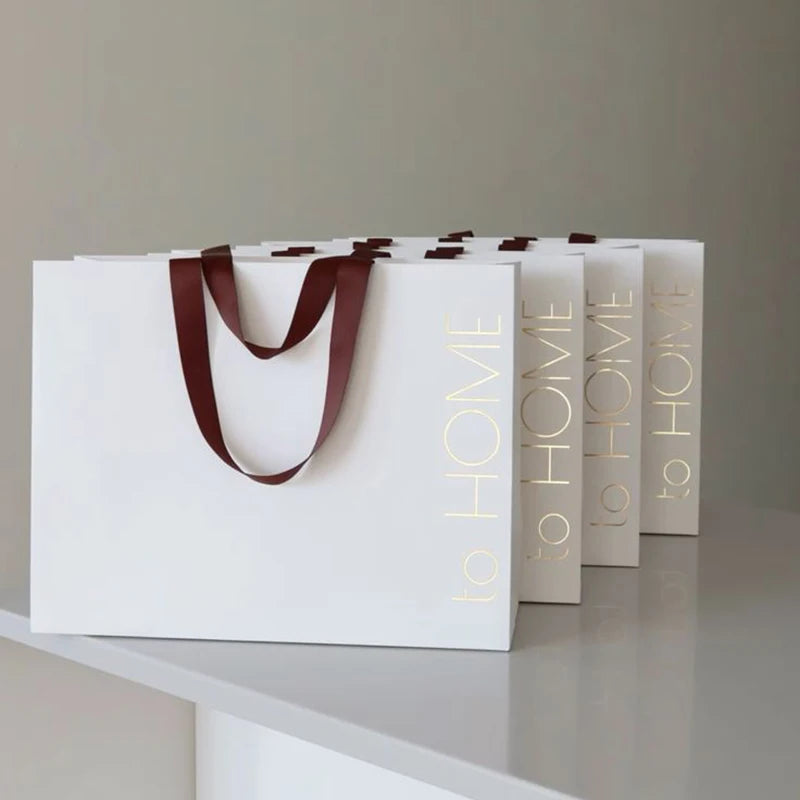 White Paper Carry Bags with Handles for Shopping Custom logo Gold Hot Stamping Packaging Paper Gift Bag with Ribbon Handles
