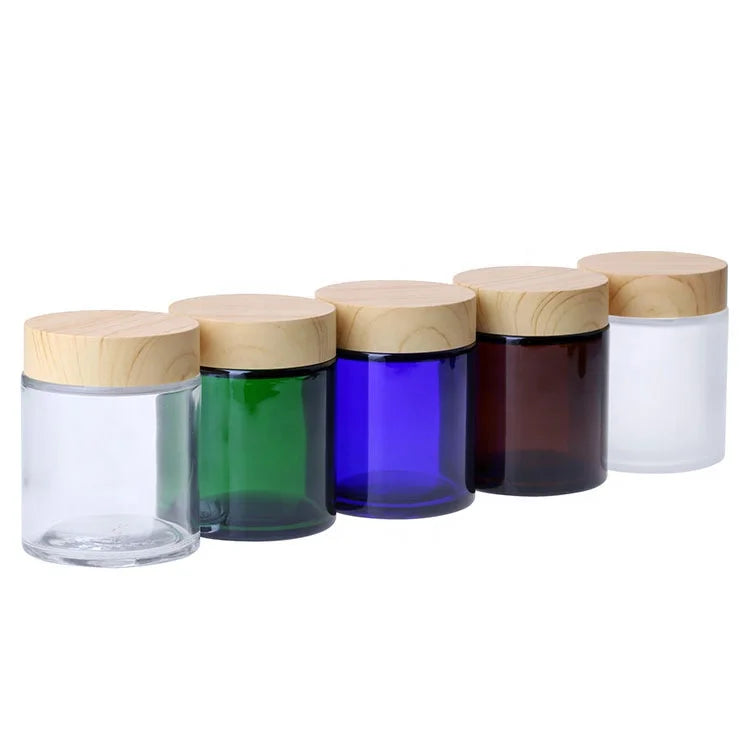 Hot Sale 100g Blue Green Amber Glass Skin Care Cream Jars with Bamboo Lid Custom Logo Industrial Use