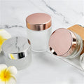Hot Sale Amber Black clear Frosted 1oz 2oz 50g 60g 100g Glass Cream Jar Bottle with Rotating Rose Gold Lid for Skin Care Cream