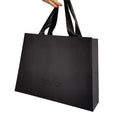 Qingdao Custom Black Printed Luxury Shopping Paper Garment Packaging Bags with UV Spot Logos Print
