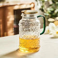 Heat Resistant Glass Pitcher with Stainless Steel LidWater Carafe with Handle Beverage Pitcher for Homemade Juice and Iced Tea
