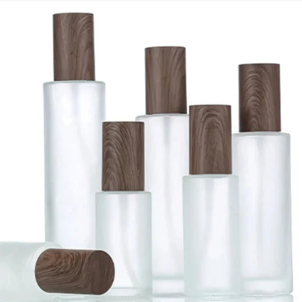 100ml 120ml Frosted Glass Serum Bottle Round Cosmetic Packaging with Press Pump for Body Lotion Sealed by Pump Sayer