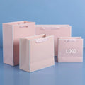 Warehouse in Stock Multi Design Women Clothing Package Store Logo Custom Printed Pink Shopping Clothing Ladies Fashion Paper Bag