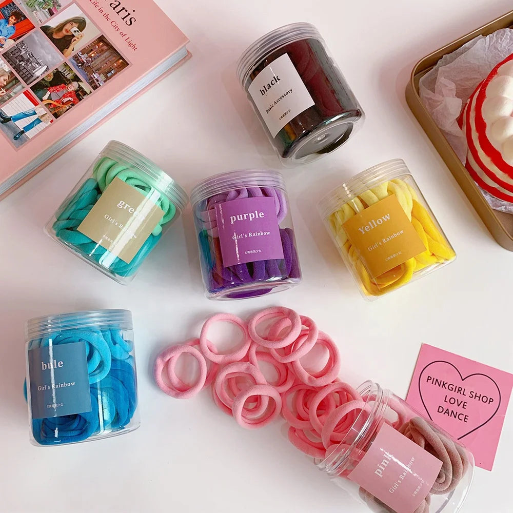 Factory Wholesale 50pcs Simple Design Seamless Strong Elastic Hair Ties Rope Candy Solid Color Ponytail Holders for Women Girls