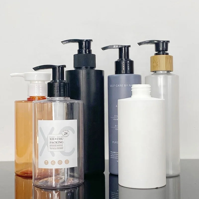 Wholesale 500ml Cylindrical Flat Shoulder Bottle with Pump Cap Shampoo Body Wash Pet Plastic Bottles