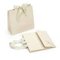 China Logo Free Design Embossed Luxury Gift Bag With Handle Kraft Bag Custom Kraft Paper Bag