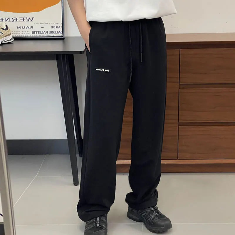 100% Cotton Fleece Jogger Men's Pants Collegiate Black Cuffed Relaxed Fit Streetwear Screen Print Rear Zip Pocket Flat Design