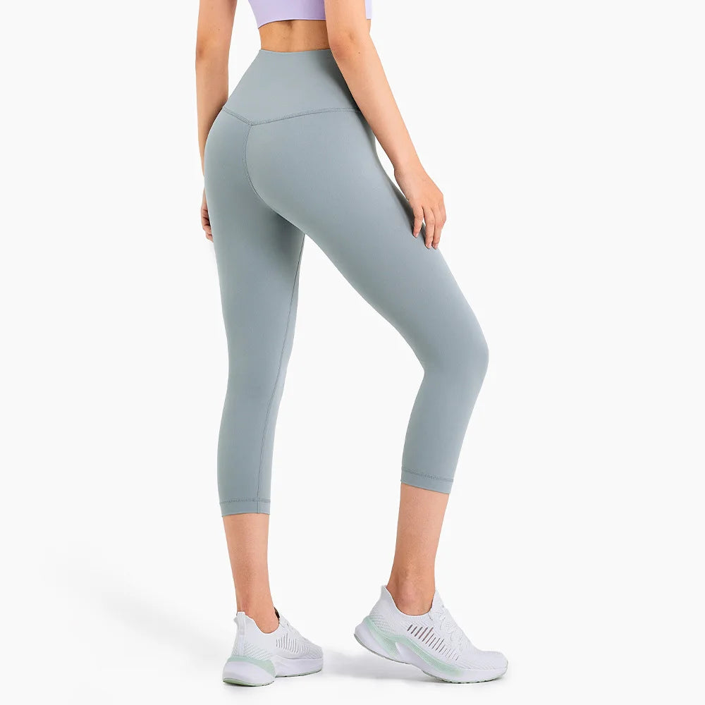 OEM Sportswear Custom Logo Hip Lift Fitness High Waist Yoga Pants Gym Butt Lift Yoga Compress Tights Seamless Cropped Trousers