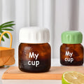 Wholesale Small Volume Borosilicate Glass Insulated Leak Proof Water Bottle with Cap Cute Style Custom Logo for Travel Use