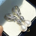 Elegant and High-quality Women Come Standard with Bell Orchid Earrings and 9mm Natural White Rice Shaped Teardrop Pearl Earrings
