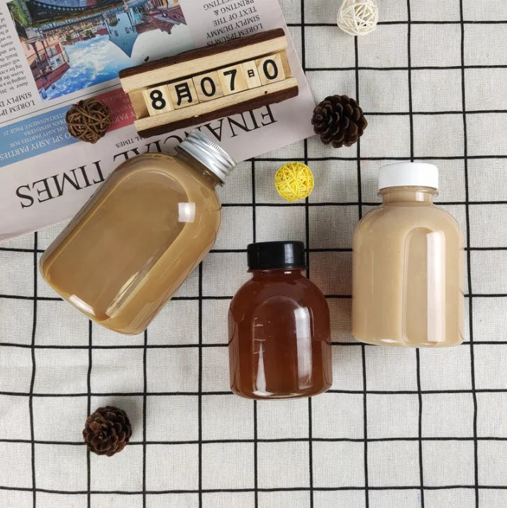 In stock cute round 250ml small plastic bottles for cold pressed beverage