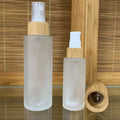 Wholesale 15ml 30ml 50ml 100ml Eco-friendly Bamboo Top Frosted clear Green Blue Glass Spray Bottle for Skin Care