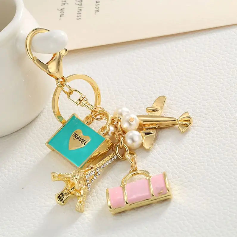 Wholesale Fashion Golden Travel Bag Airplane Eiffel Tower air Travel Keychain Pearl Bag Pendant Charms for Women Metal Key Chain