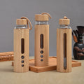 Wholesale Durable Borosilicate Glass Water Bottle with Bamboo Sleeve and Lids for Boiling Water for Camping