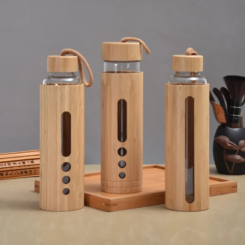 Wholesale Durable Borosilicate Glass Water Bottle with Bamboo Sleeve and Lids for Boiling Water for Camping