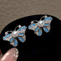 2026 New White Butterfly Pearl Stud Earrings Zhuji 5-6mm AAAA Luxury Natural Freshwater Bread Pearls Women's Personalized Brass