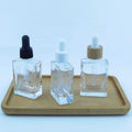 Cosmetic Packaging Glass Serum Bottle 30ml 50ml 100ml Clear Square Essential Oil Glass Bottle With Bamboo Dropper