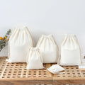 Recycle Cotton Canvas Fabric Muslin Drawstring Dust Bag Packaging Jewelry Pouch Organic Cotton Bags Manufacturers