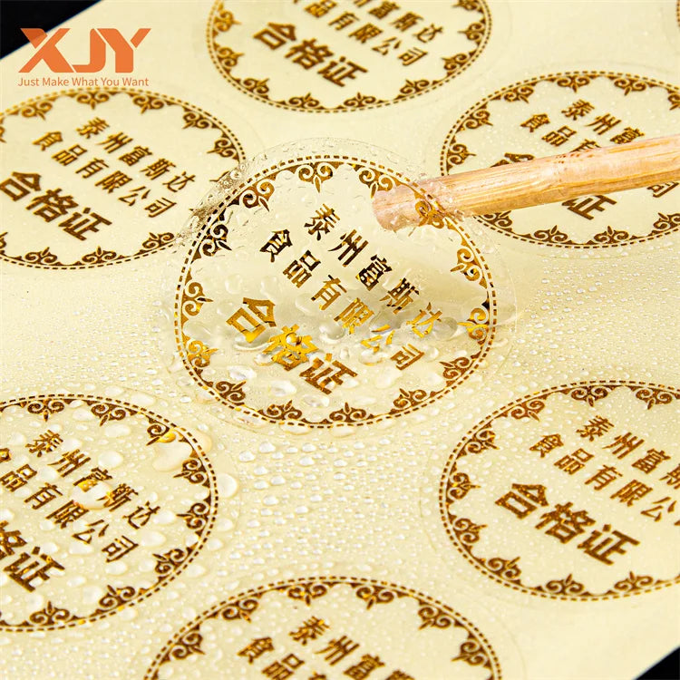 XJY Wholesale Price Self Adhesive Customized Printing Clear Gold Foil Stickers Transparent Logo Label Printing