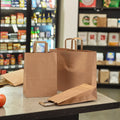 Manufacturer Cost Price Food Grade Flat Handle Cheap Gift Shopping Kraft Paper Bag Printed Custom With Your Own Logo