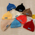 OEM Girls Boys Winter Thick PVC Patch Jacquard Chunky Knitted Hat Kids Acrylic Custom Skully Satin Lined Cuffless Fur Travel