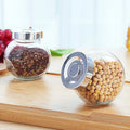 Wholesale Transparent Glass Food Storage Jars with Aluminum Cap Small & Medium Capacity Flat Drum Shape for Sugar and Milk