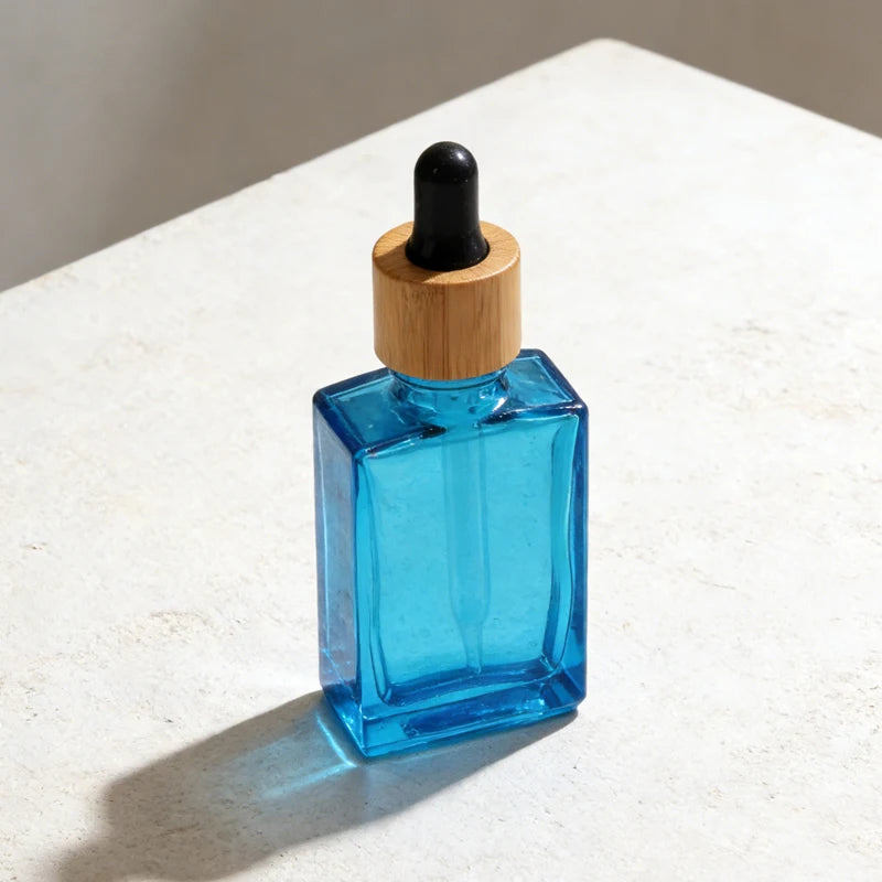 Multi-Size Square Blue Glass Bamboo Lid Dropper Bottle One-Stop Skincare Packaging Solution Factory Direct Bulk Supply