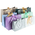 Custom Luxury Fashion Gift Carry Bags Special Paper Boutique Shopping Paper Bags With Bow