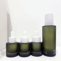 Customized Logo Print 30ml 50ml Frosted Green Essential Serum Oil Glass Bottle with Flat Shoulder Cylinder Shape Rubber Dropper