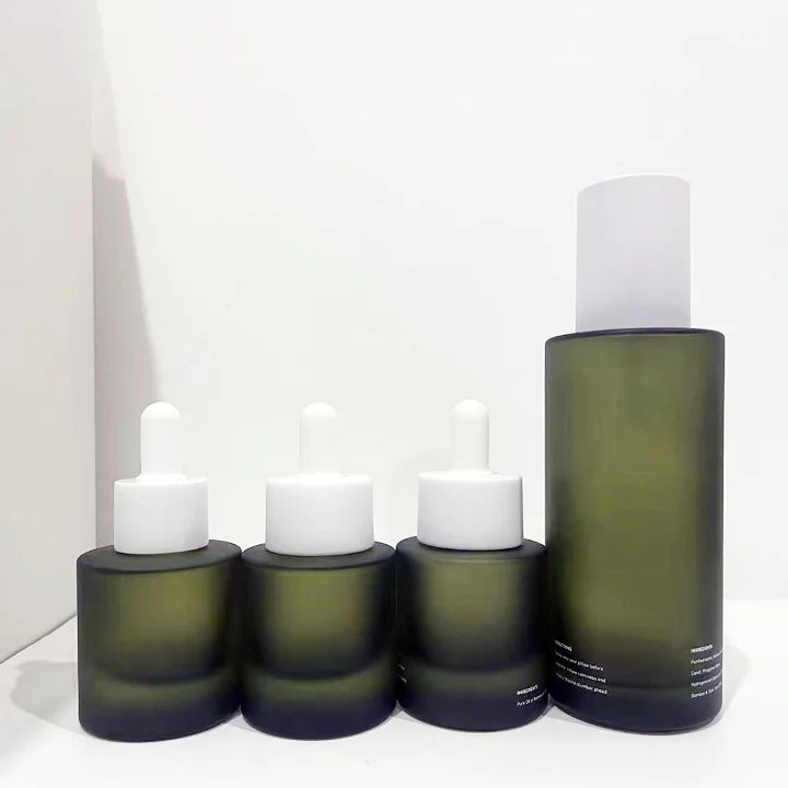 Customized Logo Print 30ml 50ml Frosted Green Essential Serum Oil Glass Bottle with Flat Shoulder Cylinder Shape Rubber Dropper