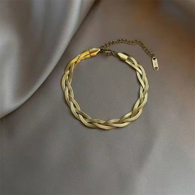 Wholesale New 316l Stainless Steel Fashion Simple Three-Layer Woven Twisted Snake Bone Bracelet