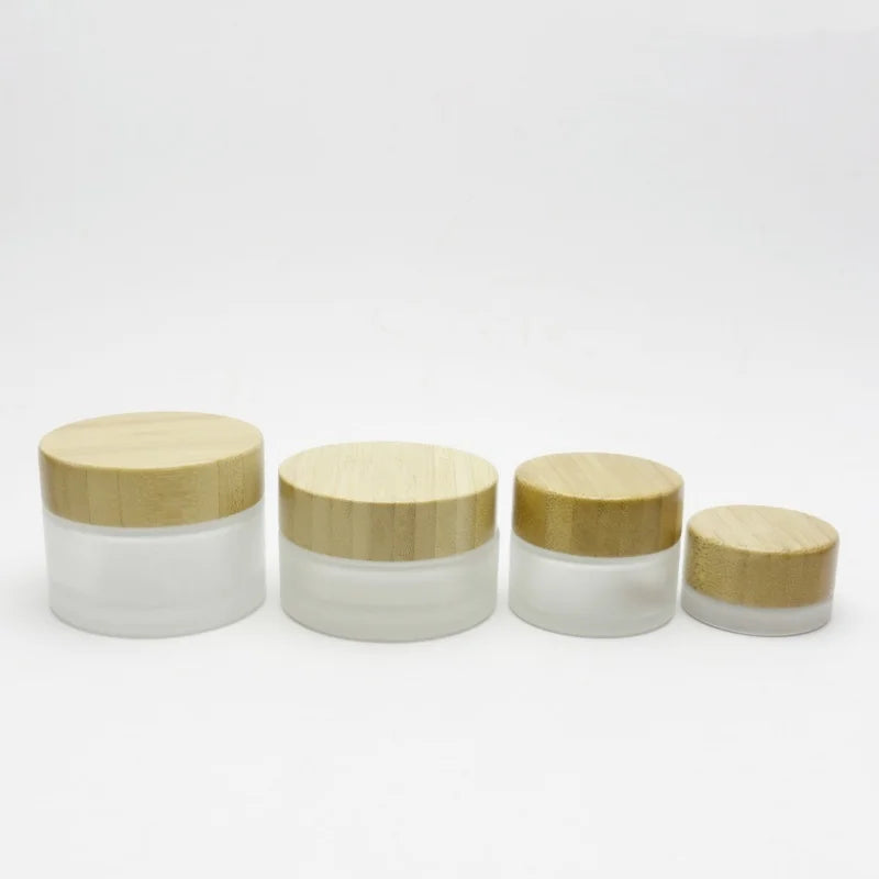 Wholesale 5g 10g 15g 20g 30ml 50g 60g 100g clear Frosted Glass Jar with Bamboo Lid for Cosmetic Skincare Scrub Cream Custom