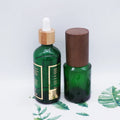 Hot Stamping 60ml 100ml Green Glass Dropper Bottle with Dark Wood Grain Lid MegaBDM