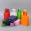 Eco Friendly Boutique Retail Gift Party Fashion Shopping Kraft Paper Bags Festival Colorful Gift Paper Bags with Twisted Handle