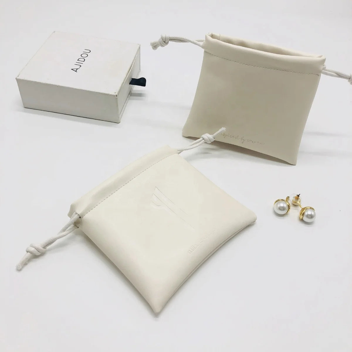 Flexography Custom Logo Printed White Pu Leather Drawstring Jewelry Bag Leather Gift Pouch Bag