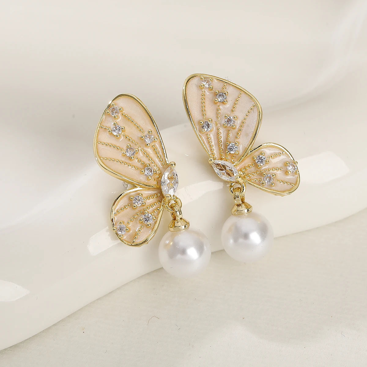 Elegant Trendy Gold-Plated Pearl Zircon Symmetric Butterfly Earrings for Women Fashionable Drop Earrings with Brass Material