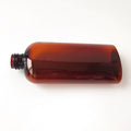 Cosmo Ovals Plastic Bottles Amber PET Cosmo Ovals With Black Disc Cap