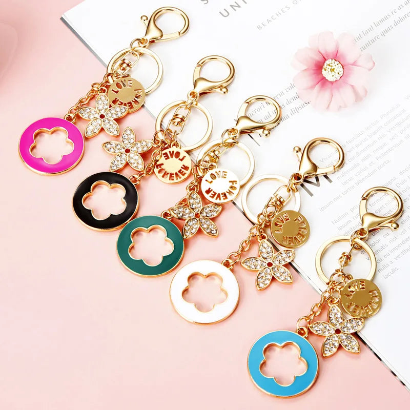Wholesale Alloy Rhinestone Clover Keychain with Enamel Flower Design Rechargeable Color Changing Features for Girls