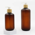 Plastic Mini Body Lotion Bottles 60ml 120ml 250ml Frosted Amber Pet Shampoo Bottles Packing with Bamboo