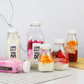 Empty Clear Coffee Fuit Budding Juice Drinking Glass Packaging Bottle With Anti-pilfer Screw Cap Custom Label Logo Printing