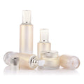 Wholesale Custom logo Luxury 50g 40ml 60ml 100ml and 120ml Grade Gold Cosmetic Glass Bottle and Jar with Gold Pump and clear Cap