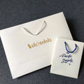 White Folding Cardboard Paper Shopping Bag Recycled Paper Handle Bag Custom logo Shopping Bag for Clothes Packing
