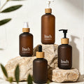 Wholesale Boston Round Amber Frosted Plastic Shampoo Bottle with Bamboo Lid Empty Plastic Bottles for Lotion Cream Shampoo Use