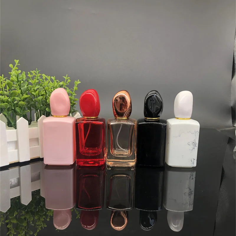 2021 Free Sample Feather Design Wholesale Luxury Refillable Custom 30ml 50ml 100ml Spray Empty Glass Perfume Bottles