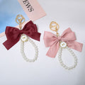 Cute Pearl Silhouette Bow Tie Keychain Wristlet Bracelets Keyring for Women Purse Bag Charm Accessories with Silly Doll Pattern
